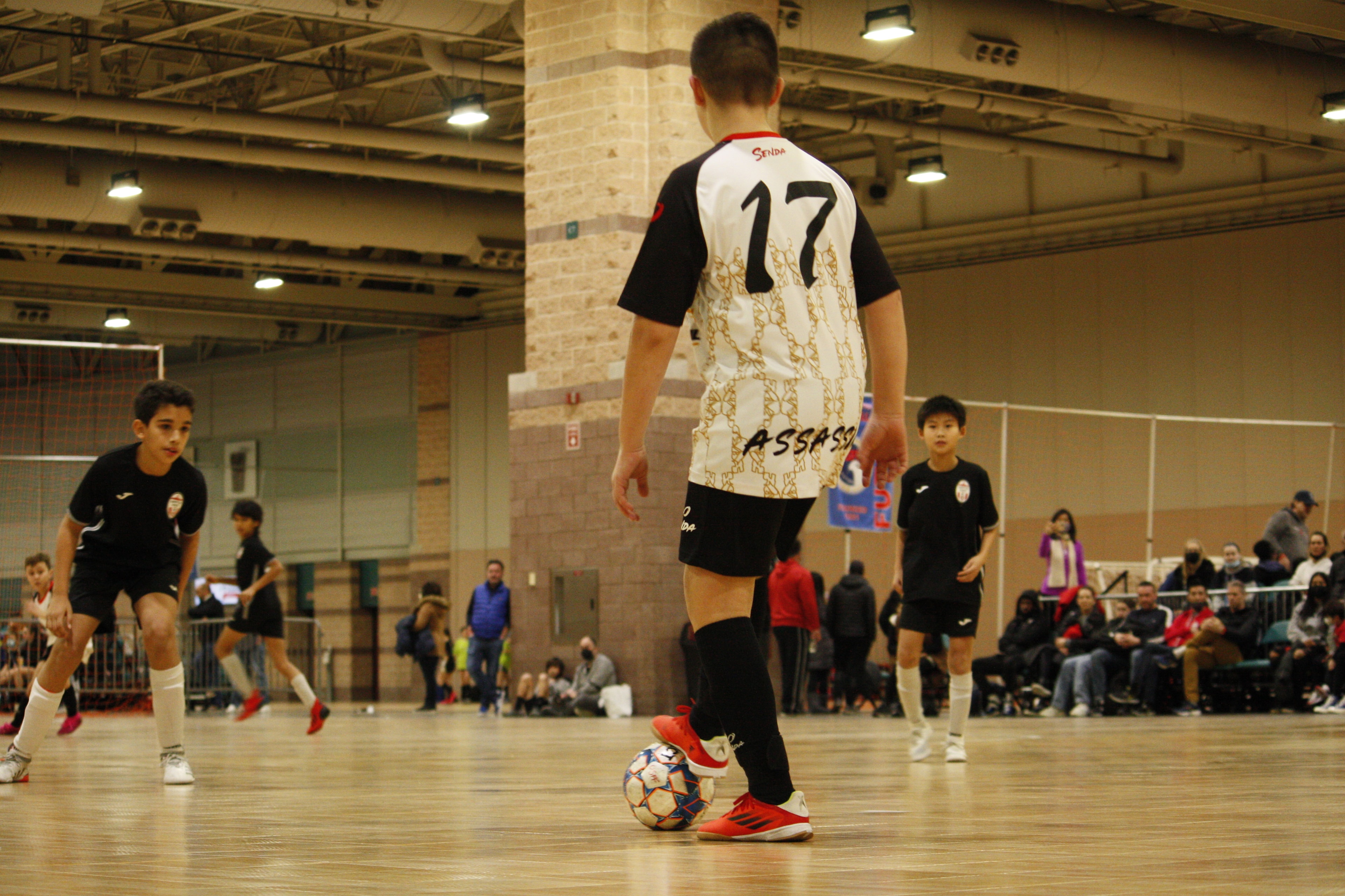 Assassins Futsal Club — match action indoor gymnasium
